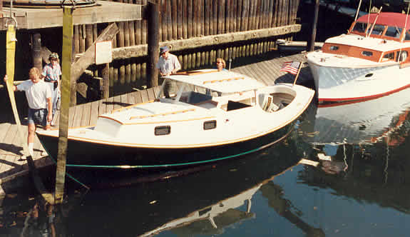 Launch day for a St. Pierre Dory. Note the tilted motor in its well 